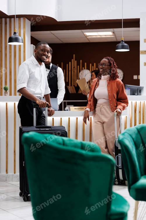 Preview: African american couple at front desk