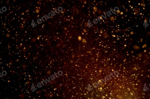 Preview: Natural organic golden dust particles floating on black background. Glittering sparkling flickering