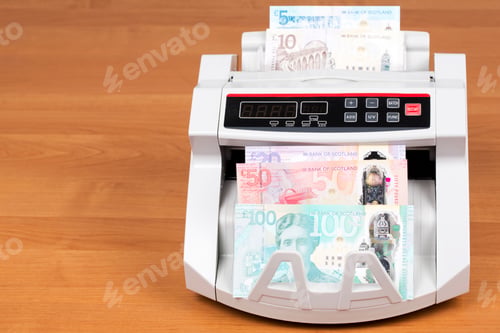 Preview: Scottish money in a counting machine
