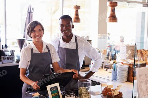 Preview: Portrait Of Staff Working At Delicatessen Checkout