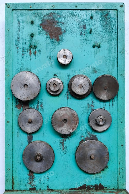 Preview: Gear wheels of industrial machinery, disused in a workshop.