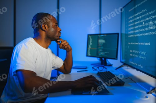 Preview: African american IT Programmer Working on Desktop Computer.