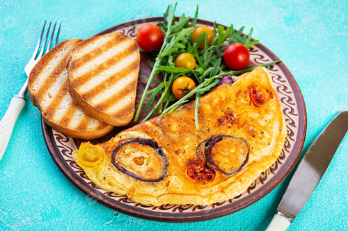 Preview: Omelet with tomato, onion, cheese and herbs. Tasty breakfast omelette