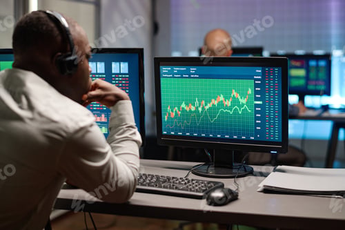 Preview: Man Looking At Charts