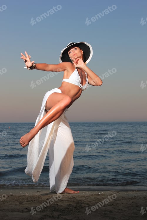 Preview: woman relaxing on the beach