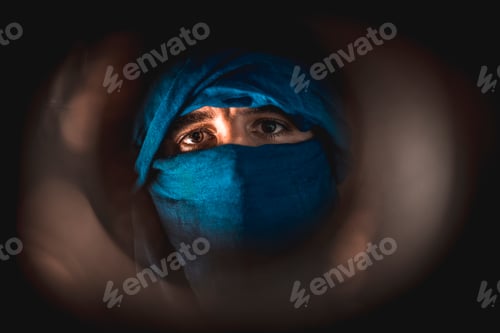 Preview: Simulation of a Berber covered in blue cloth in the desert of Merzouga in Morocco