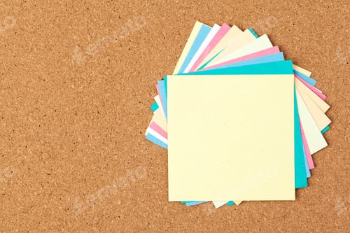 Preview: Cork board with several colorful blank notes with pins