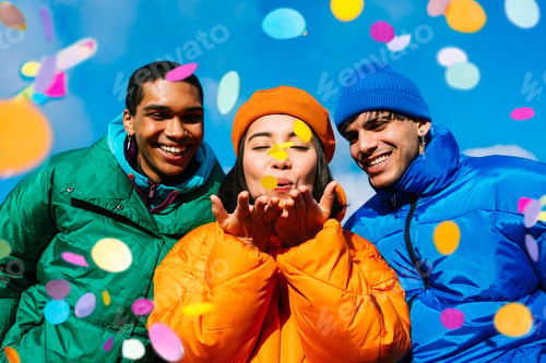 Preview: Multiracial group of young friends meeting outdoors in winter