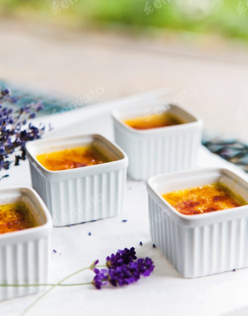 Preview: Four dishes of caramelized custards on table