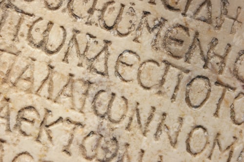 Preview: Close up of an ancient text carved on marble.