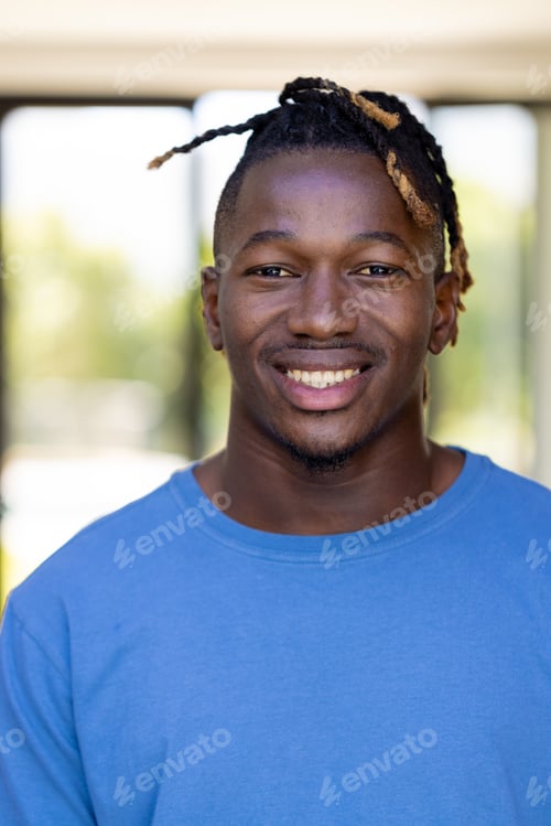 Preview: Portrait of happy african american man looking at camera and smiling