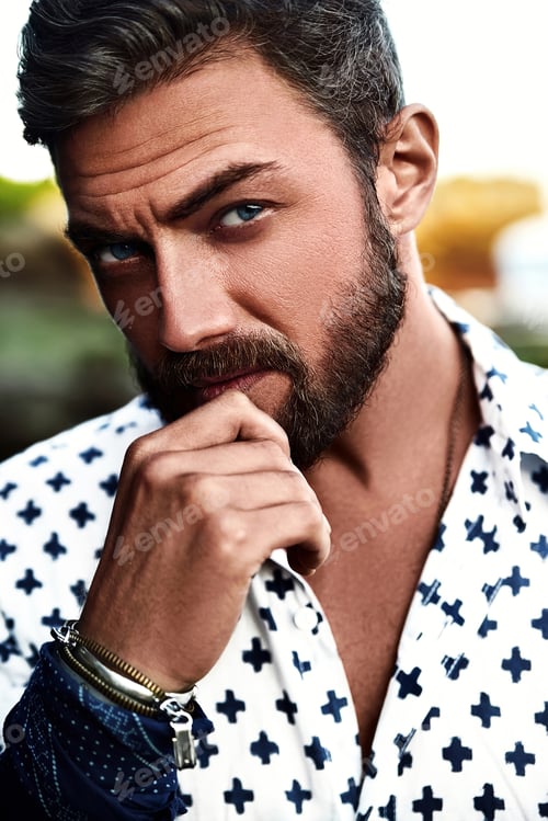 Preview: Portrait of handsome man posing at the beach