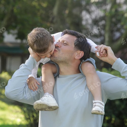 Preview: Young Father With Child in Park