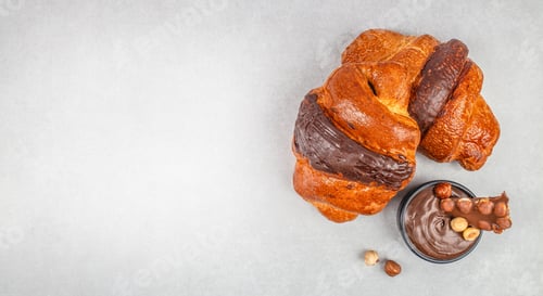 Preview: Chocolate croissants with hazelnut spread top view banner