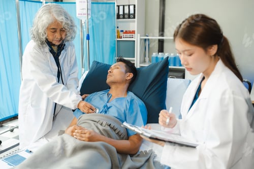 Preview: Doctor talking with man patient for monitoring and check up after surgery.
