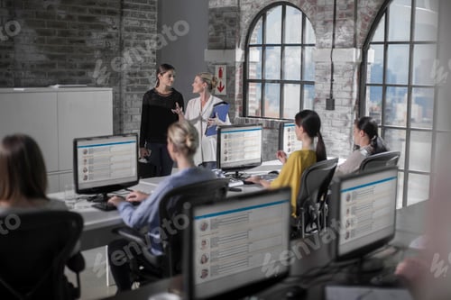 Preview: Female workers at training presentation in call centre