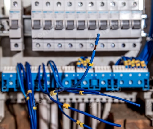 Preview: the Assembly of the electrical panel, electrician job, a robot with wires and circuit breakers