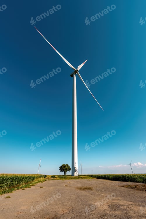 Preview: Large with turbine and small tree in field
