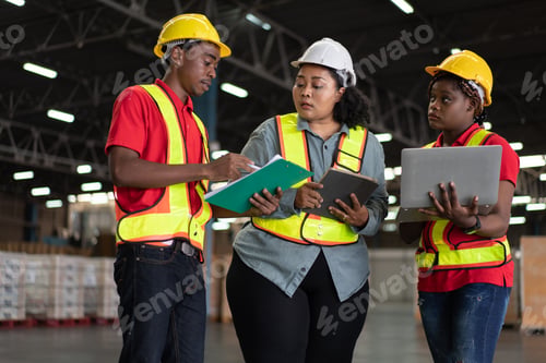 Preview: African worker reporting work to manager. Group of logistic staff working at warehouse