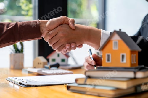 Preview: Successful deal Real estate lease or home purchase concept buyer shakes hands with bank employee aft