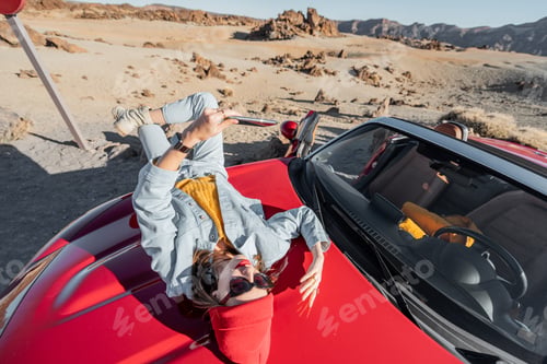 Preview: Carefree woman traveling by car