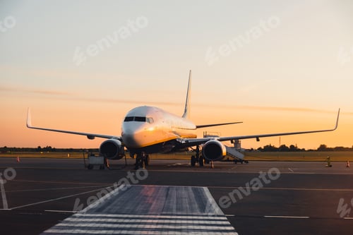 Preview: Airplane at the terminal ready to take off. World travel concept. Low-cost budget airline passenger
