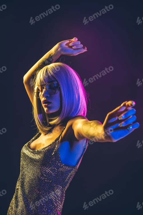 Preview: Young woman with grey hair dancing and celebrate