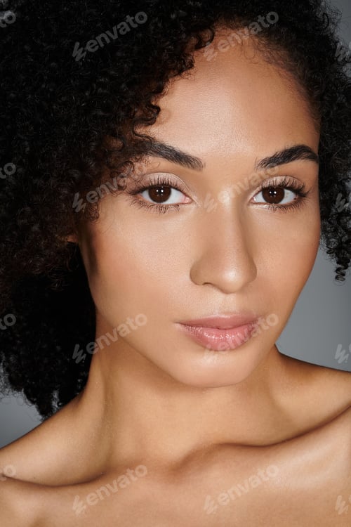 Preview: A captivating woman showcases her unique style in elegant attire, exuding confidence and grace