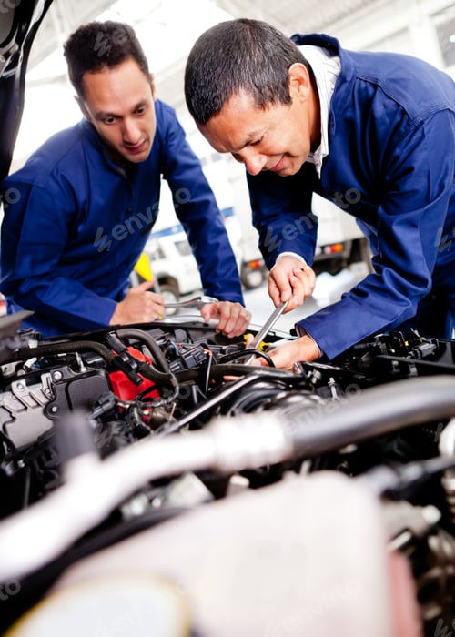 Preview: Car Mechanics Working On A Broken Engine