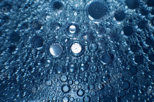 Preview: abstract light blue background with oil circles . bubbles of water close up