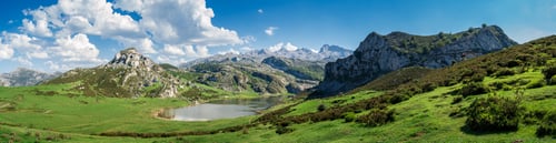 Preview: Scenic view of Covadonga Lakes in Asturias, Spain against a cloudy blue sky