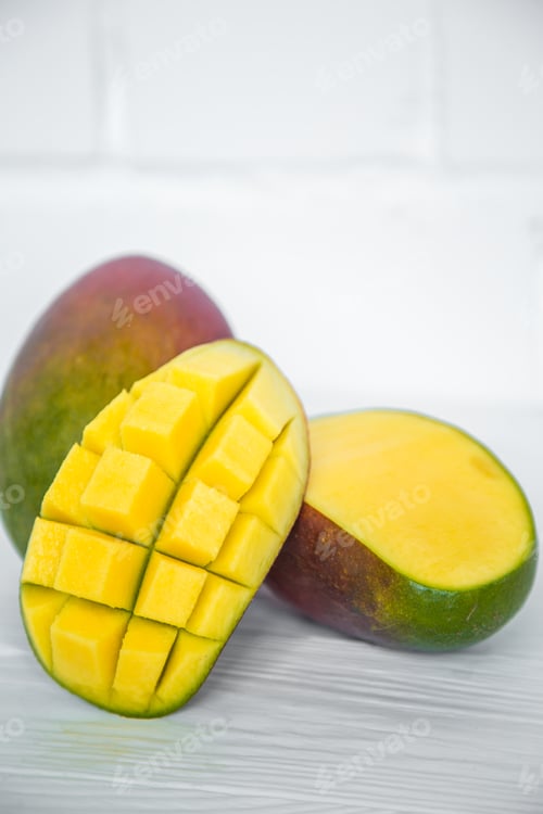 Preview: Mango on a white wooden background