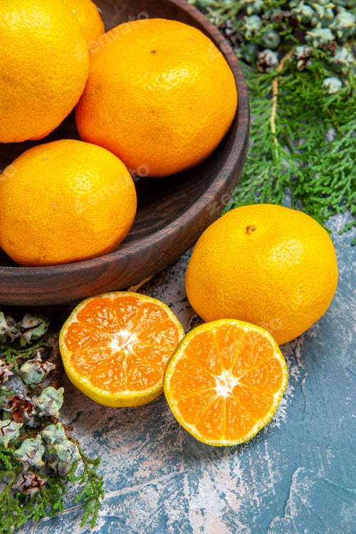 Preview: top view fresh tangerines on light-blue background citrus juice photo fruit color