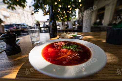 Preview: close up view of yummy Borscht in a white plate