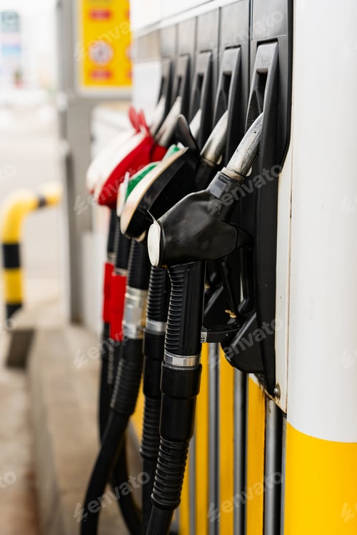 Preview: Fuel pump nozzles at gasoline station close-up for automotive use.