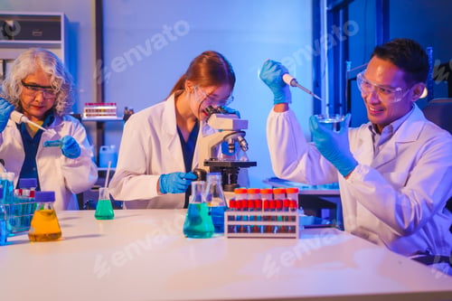 Preview: Two Asian men and women sit at a table in a laboratory, conducting research on liquids. They use