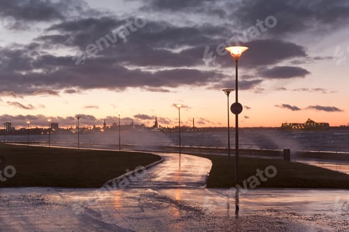 Preview: A weather storm, black clouds and waves crashing over the waterfront