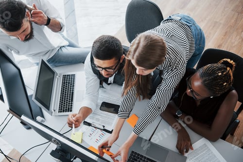 Preview: A group of multinational busy people working in the office