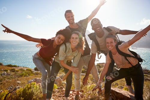 Preview: Millennial friends on a hiking trip reach the summit and have fun posing for photos