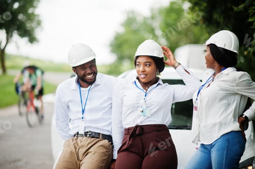 Preview: Group of three black engineers meeting.