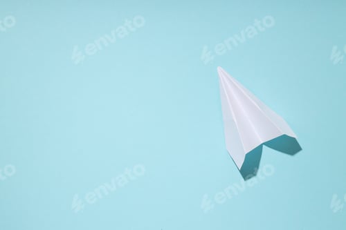Preview: Business, startup and sponsorship concept with paper plane on blue background