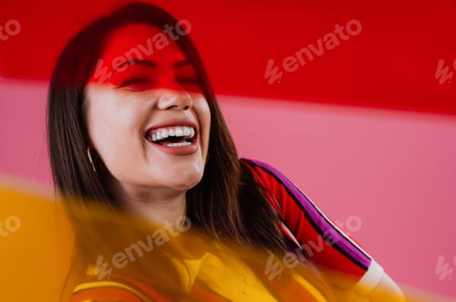 Preview: Smiling woman posing against vibrant colorful background