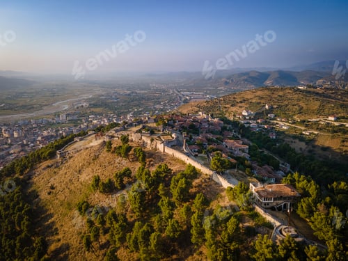 Preview: Aerial view of the old Castle in Berat and its ancient neighborhoods in sunset light