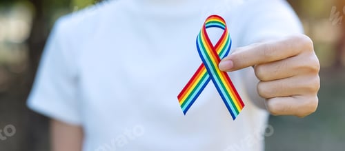 Preview: hand showing LGBTQ Rainbow ribbon