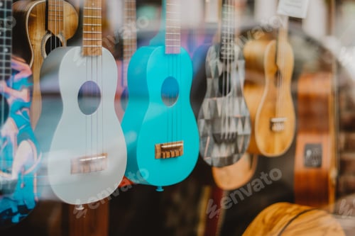 Preview: ⭐️Nominated ⭐️ Music in the city. Bright and colorful guitars in the shop window behind the glass