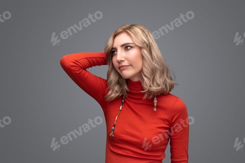 Preview: Displeased woman scratching head