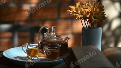 Preview: Traditional tea set with cups and teapot on rustic wooden table with leaves shadow.