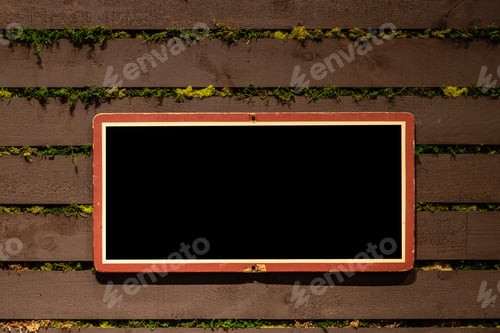 Preview: Mock-up horizontal frame made of rough wood painted in black on rustic wooden background