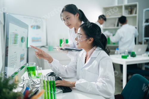 Preview: Laboratory microscope research scientists working in white lab coats conducting scientific analysis