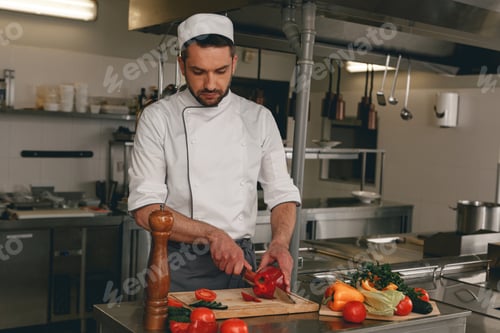 Preview: Chef preparing salad in the modern kitchen of restaurant. Tasty and healthy food